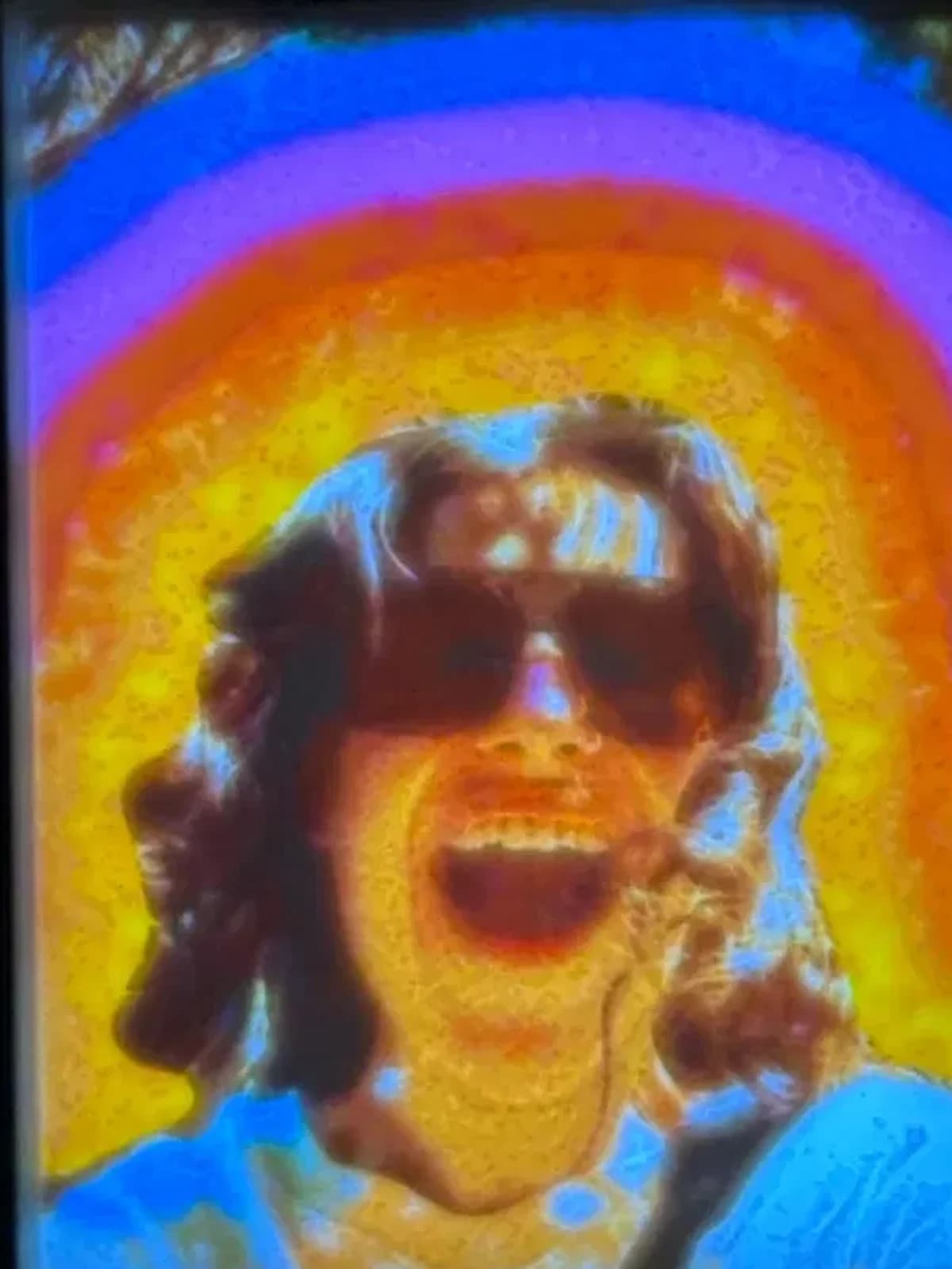 The same panel switched on: the photograph glowing in colour